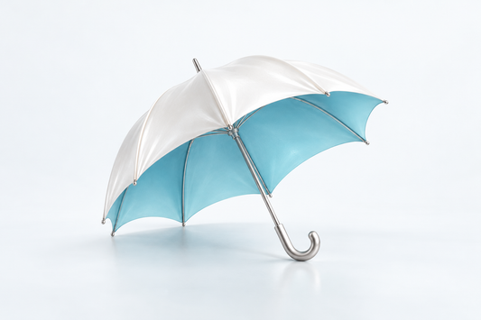 A pearl-white umbrella opens to reveal a clear cyan interior on a light surface.