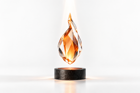 A faceted orange crystal flame receiving light above a dark pedestal, symbolizing the source of spiritual power