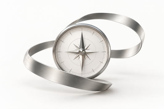A silver compass encircled by a flexible metal band, symbolizing adaptable thinking anchored in truth