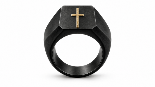 A charcoal signet ring bearing a gold cross on white, symbolising belonging beyond outward appearance.